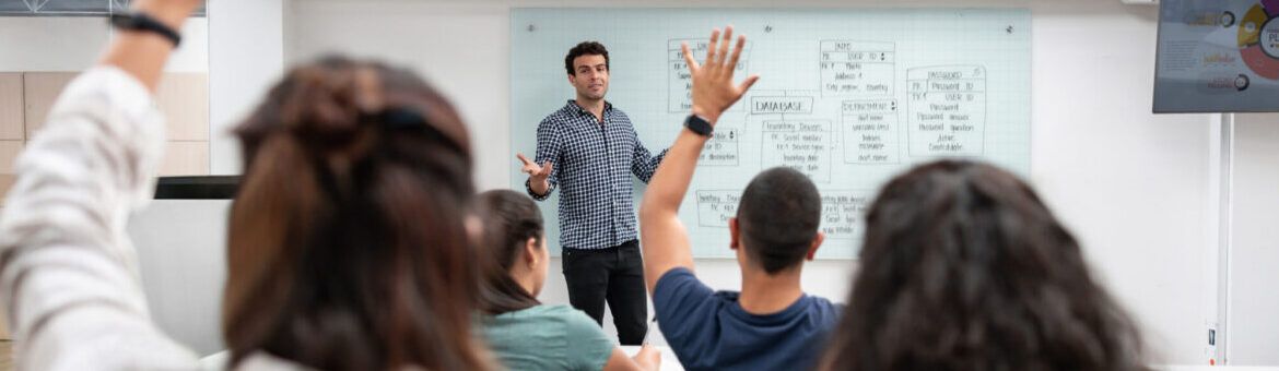 Male teacher teaching in classroom