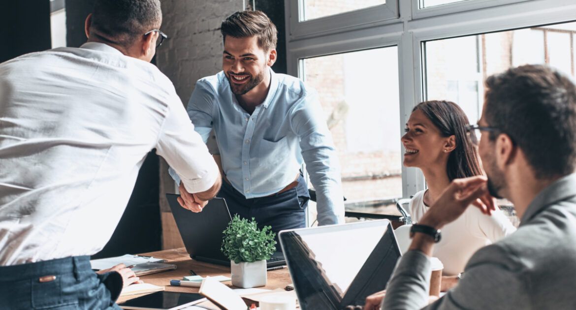 two men shaking hands after a successful job interview