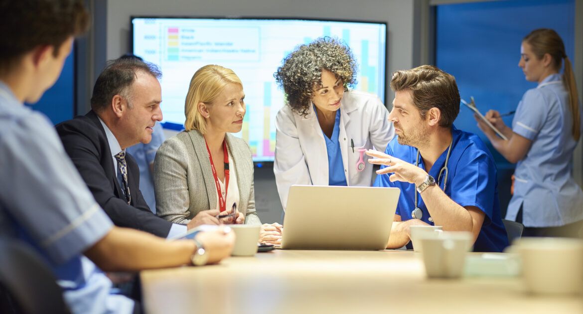 hospital management listening to doctor