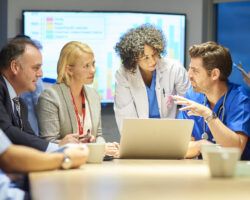 hospital management listening to doctor