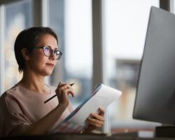 Woman thinking at laptop