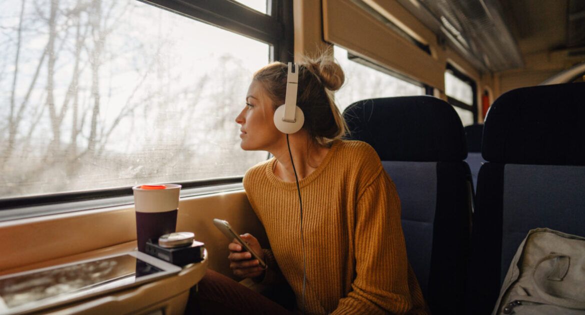 Young woman riding a train