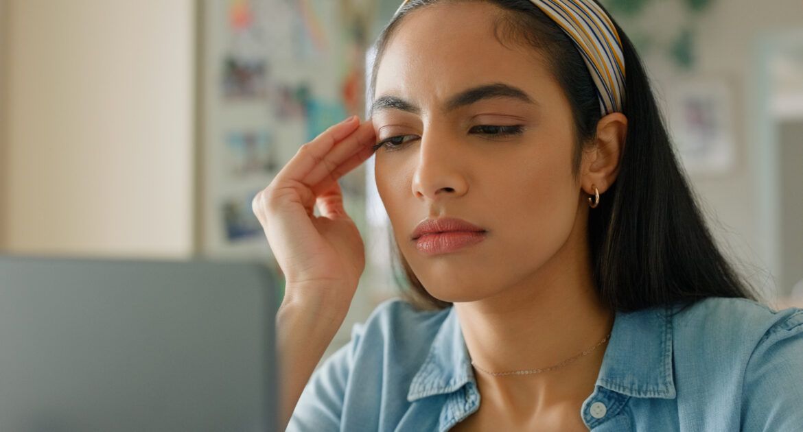 female student looking confused as she reads article called What NOT to do as a new PhD student