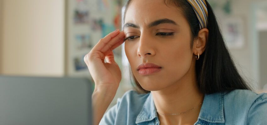 female student looking confused as she reads article called What NOT to do as a new PhD student