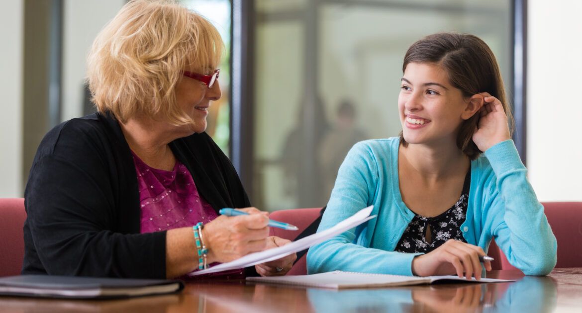 female student meeting with academic advisor